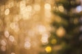 Bokeh lights background with christmas tree. Abstract golden colored light. Christmas concept Royalty Free Stock Photo