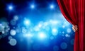 Bokeh lights behind drapery curtain and hand opening it Royalty Free Stock Photo