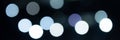 bokeh lights. blurred night white blue gray abstract texture glowing neon light on black background Royalty Free Stock Photo