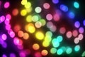 Bokeh lights holiday background. Defocused gold, blue, red and g