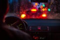 Bokeh lights from traffic jam through a car windscreen on Rainy night in the big city Royalty Free Stock Photo