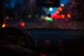 Bokeh lights from traffic on wet day. Night storm raining car driving concept