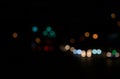 Bokeh of night shot, road, street lights, transportation abstract in city. Beautiful blurry colored lights.