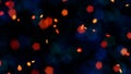 Bokeh orange embers and blue lights against a black background Royalty Free Stock Photo