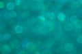 Bokeh pastel aqua background with blurred rainbow lights. Royalty Free Stock Photo