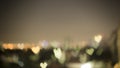 Bokeh photo of soft and blurred red, yellow and white hearts light, shape of shiny lights from the city in dark gray night sky Royalty Free Stock Photo