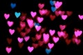 Bokeh pink and blue in the shape of a heart on a black background, selective focus. Bokeh Lights Heart Soft Royalty Free Stock Photo