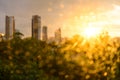 Bokeh of raindrop on glass with building background at sunset