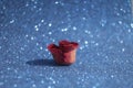 Bokeh with red rose bud on blue background Royalty Free Stock Photo