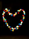 Bokeh with the shape of a heart with multi colors Royalty Free Stock Photo