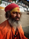 Bokeh shot of a hindu saint who is meditating at the ghats of Varanasi near river Ganges.