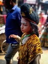 Bokeh shot of a small boy who is dressed up like Lord Shiva on the occasion of Mahashivratri in Varanasi, India.