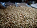 Bokeh shot of small seeds used for Hindu rituals is being sold in a grocery store in India