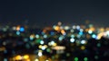 Bokeh of skyscraper buildings in city with lights, Blurry photo at night time. Cityscape background Royalty Free Stock Photo