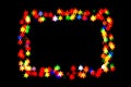 Bokeh stars isolated on a black background stars of different colors form a frame