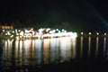 Bokeo from the light of the building at night Beautiful river town Royalty Free Stock Photo