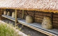 Line of large straw beehives, Bokrijk Belgium