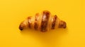 Bold Chromaticity: Croissant Flatlay On Yellow Background