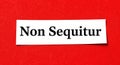 Bold declaration Non Sequitur stands out on vibrant red background for impactful communication Royalty Free Stock Photo