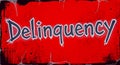 Bold \'Delinquency\' typography on a vibrant red distressed background with grunge elements Royalty Free Stock Photo