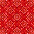 Bold ethnic paisley diamond seamless pattern in red orange white for textile, fabric, wallpaper. Royalty Free Stock Photo