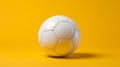 Bold And Graceful: White Soccer Ball With Yellow Backdrop