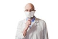 Bold male doctor on white uniform and thermometer in his hand. White background. Man wearing mask and glasses