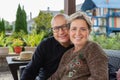 Bold man and woman with short haircut on terrace Royalty Free Stock Photo