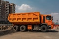 Modular Constructivism-Inspired Orange Construction Truck: Angular Design & Geometry