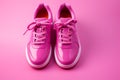 Bold pink sneakers make a statement against the pink background