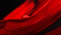 Bold Red Paint Smears and Splatters on a Black Surface abstract background Royalty Free Stock Photo