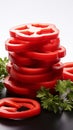 Bold red pepper slices arranged on a white background, showcasing their vibrant hue