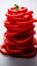 Bold red pepper slices arranged on a white background, showcasing their vibrant hue