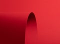Bold scarlet red paper background with a deep matte texture and overlapping folds. Vibrant crimson