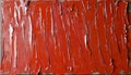 Bold strokes of crimson paint create a vibrant texture on canvas artwork Royalty Free Stock Photo