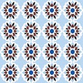Bold and stylish blue and red floral seamless repeating pattern with symmetrical geometric patterns inspired