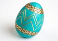 Bold Turquoise Easter Egg with Golden Zigzags Royalty Free Stock Photo