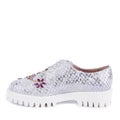 Bold woman\'s shoe made from silver material, imitating fish scales, with a white ribbed sole