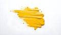 bold yellow stroke of paint with brush marks on a white background Royalty Free Stock Photo