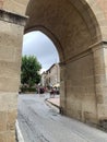 Bolgheri, Livorno, Italy, view of Teresa square through the central entrance of the Bolgheri Castle.