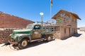 Bolivia Colchani old rusty van parked in front of a salt house