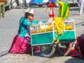 BOLIVIA, LA PAZ, 24 JULY 2008: Street orange juice woman seller with small carriage in La Paz, Bolivia, South America Royalty Free Stock Photo
