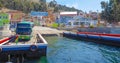 Bolivia Titicaca lake wooden ferry carrying a bus