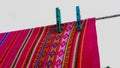 Bolivian aguayo, this typical garment is worn in multiple ways, it features bright colors and geometric patterns