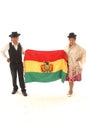 Bolivian couple looking straight ahead full body with hat with typical clothes and Bolivian flag-May 2018