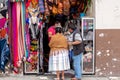 A Bolivian couple are next to the store