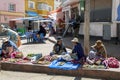 Bolivian street vendors wearing traditional clothes and bowler hats.