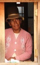 A Bolivian woman looking out the window