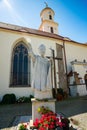 Bolkow, Poland - August 08, 2021. Catholic church of Saint Jadwiga in Main square with statue of Pope John Paul II