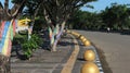 bollard ball barrier between road and sidewalk part of street furniture as a road divider to protect pedestrians